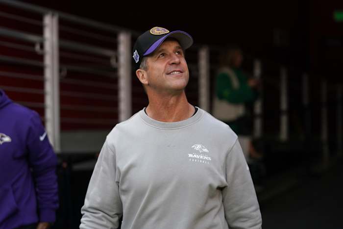 Baltimore Ravens head coach John Harbaugh walks onto the field